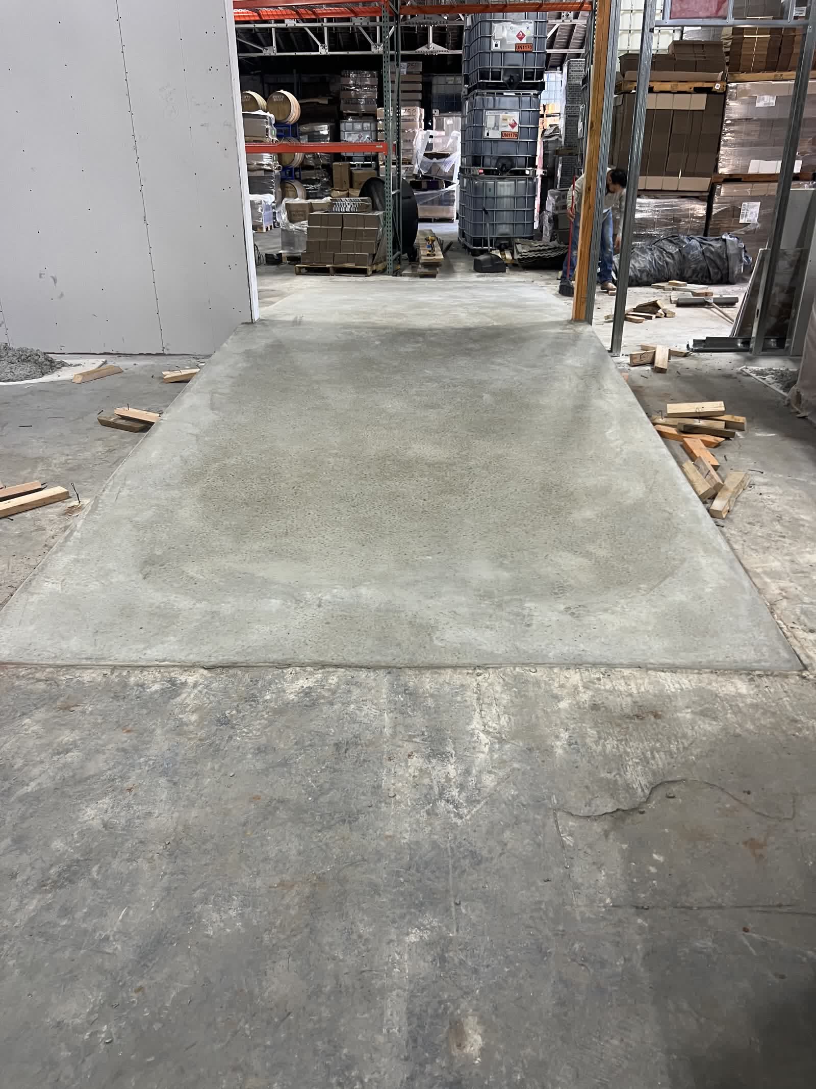 Finished concrete forklift ramp in Guthrie, Oklahoma — smooth trowel finish flush with warehouse floor