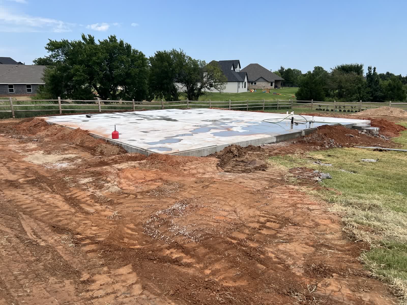 Finished pier foundation thickened slab curing in Edmond, Oklahoma